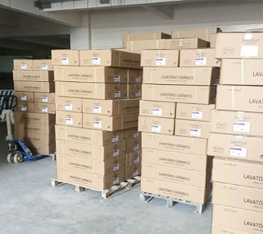Supplied CADIA photograph of packed cartons in a factory area